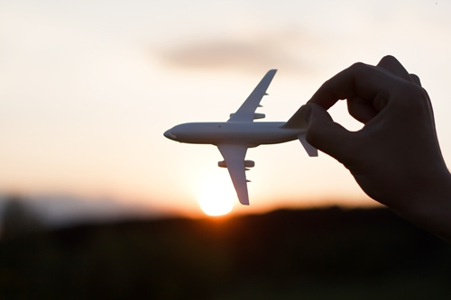 Toy plane at sunset