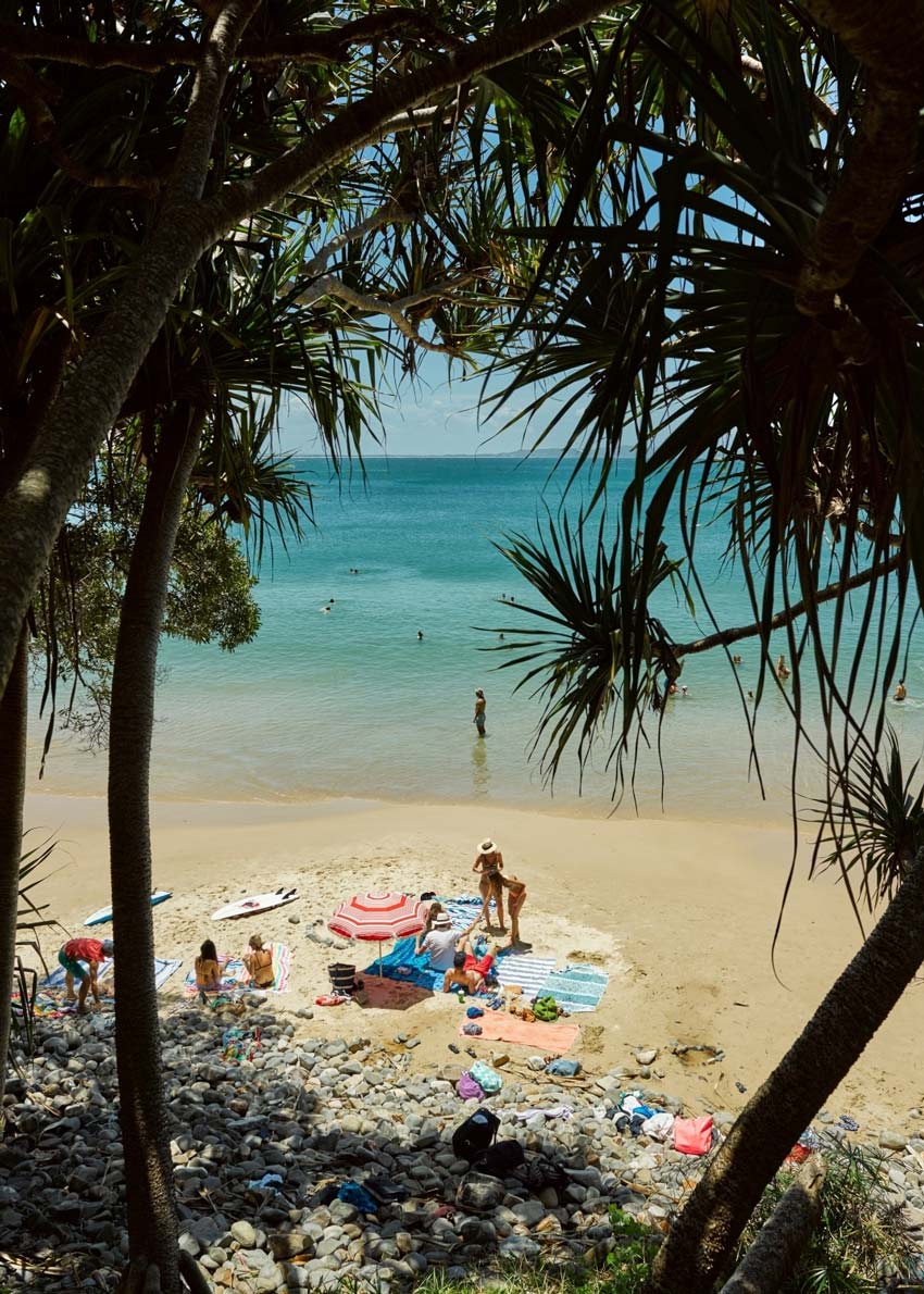 Family on the beach at Noosa, QLD Australia