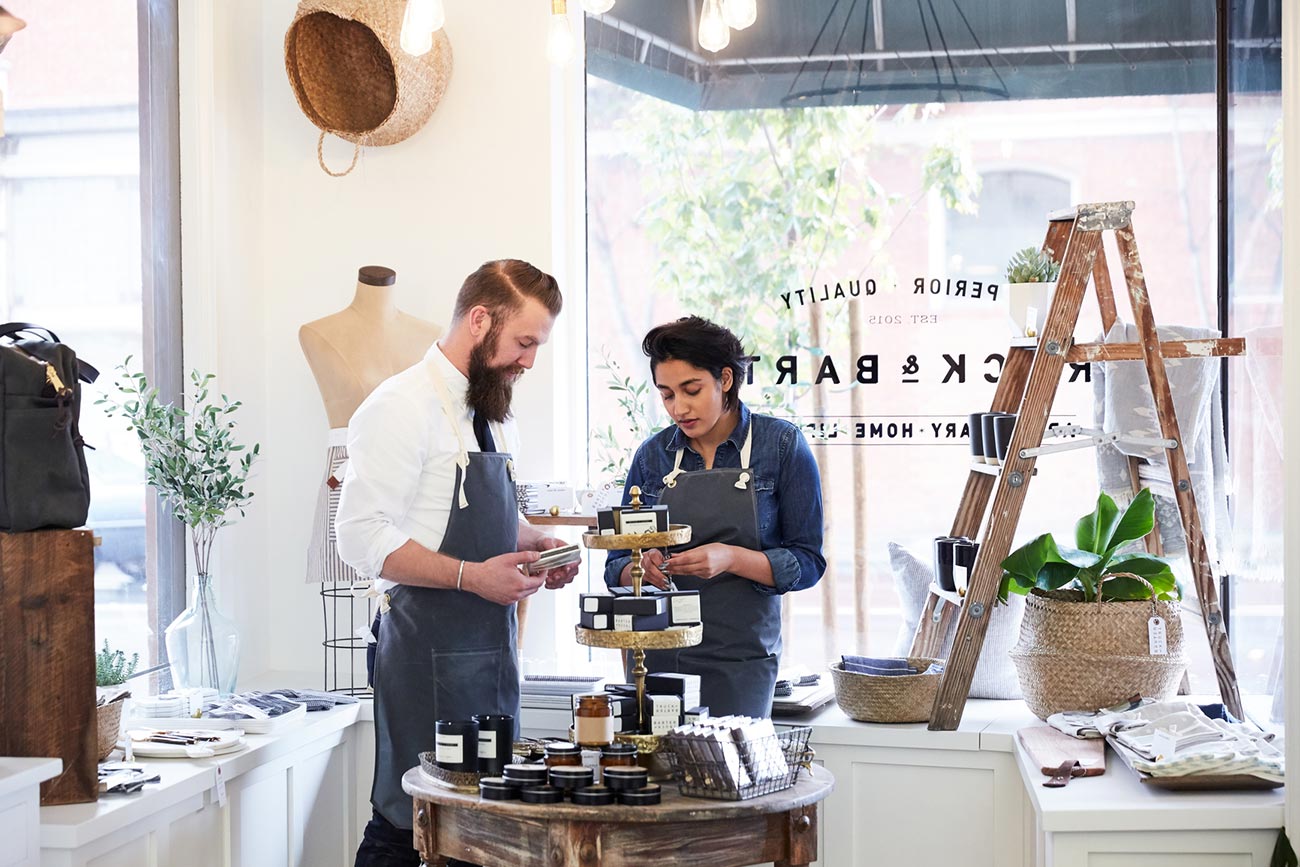 Millennial co-workers talking and working together