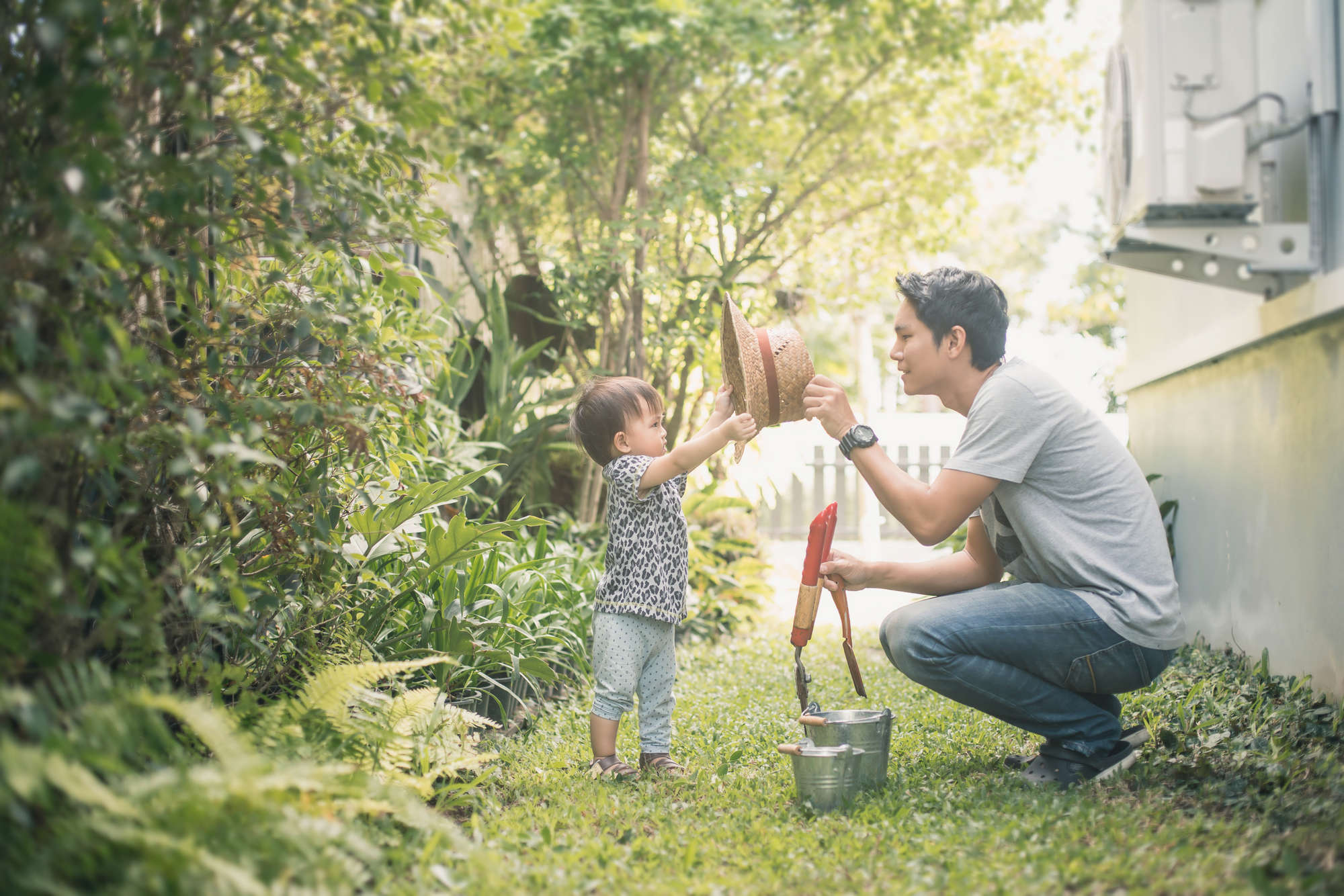 Happy joyful young father with his little daughter.