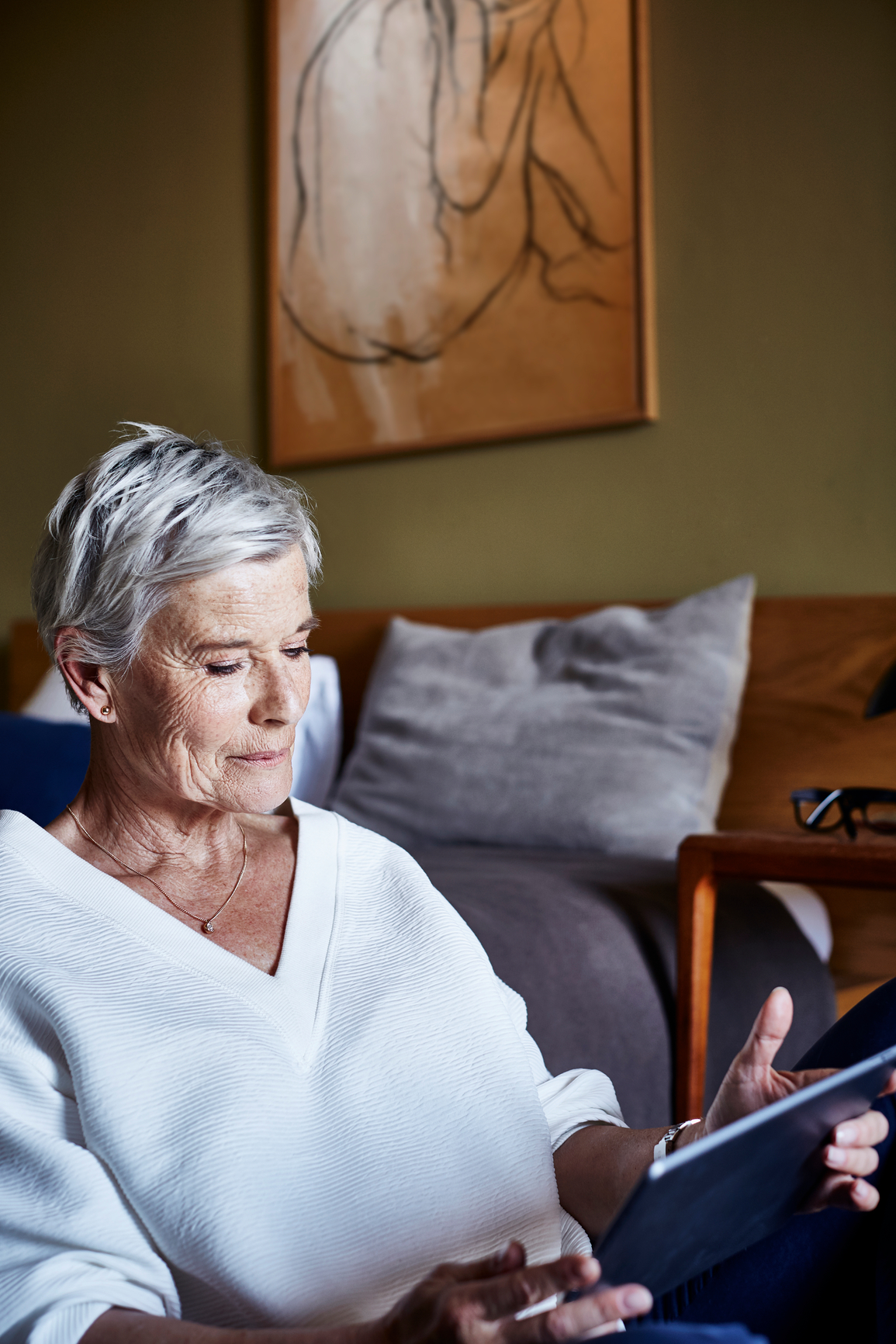 Senior Woman Using Digital Tablet