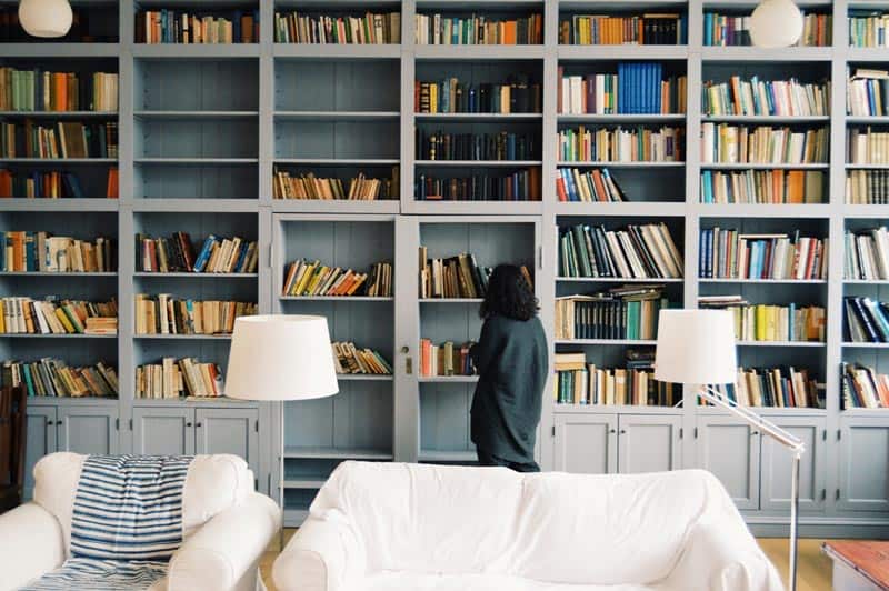 girl inside home library happiness discretionary income